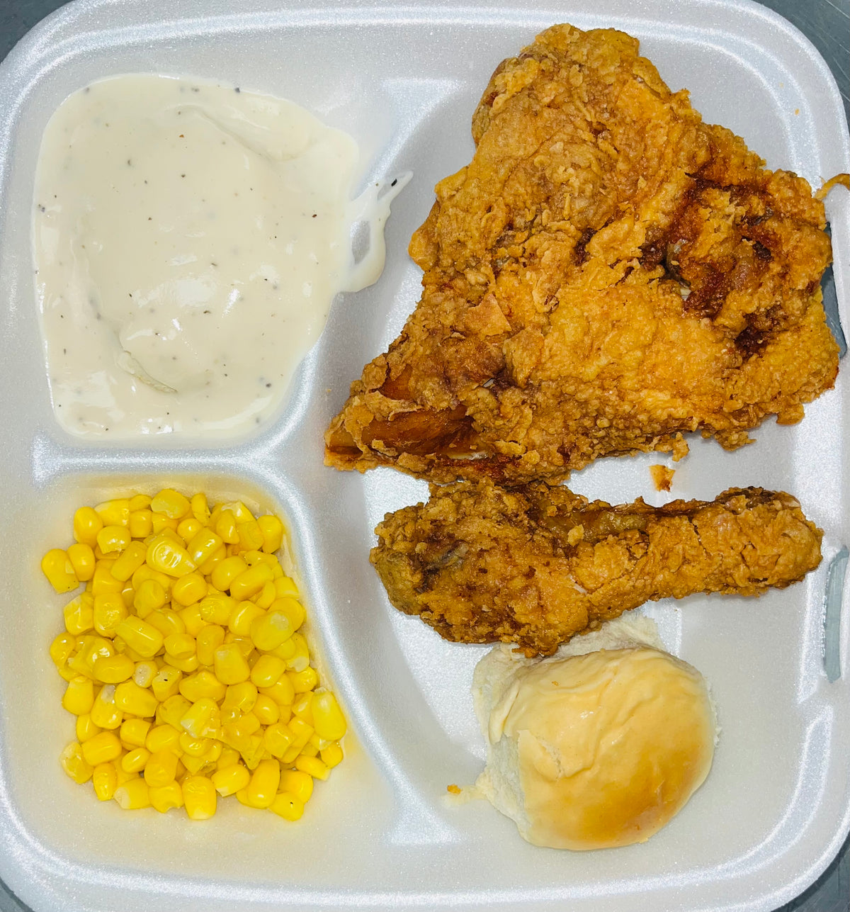 Chicken Breast & Leg, Mashed Potatoes & gravy, and a veg. (corn or green beans)
